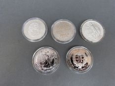 Two silver Britannia coins together with three further silver crowns, Jersey,