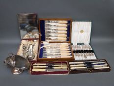 A quantity of cased sets of flatware, comprising fish knives and forks, pickle forks,