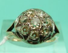 A Georgian/Victorian ring set with old mine cut diamonds in a cluster (Size M)