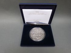 A 5oz silver 2004 George and the Dragon annual history commemorative coin,