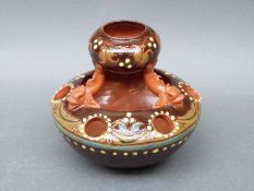 A CH Brannam pottery flower stand/jardiniere with fish supports,