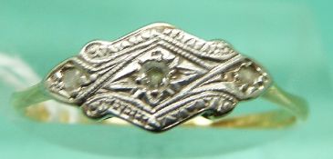 An 18ct gold ring set with diamonds in a platinum illusion setting (Size K)