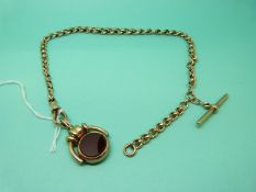 A graduated Victorian 9ct gold Albert made up of faceted and oval links with T bar and clip,