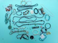 A silver necklace, pearl bracelets, quartz bracelets,