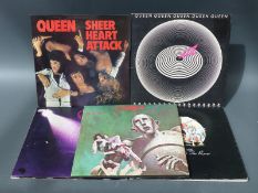 Eight Queen LPs in at least VG condition including Jazz with attached bicycle race poster,