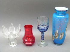 Four items of studio glassware including a large goblet with applied spirals,