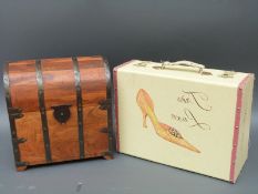 A wine caddy in the form of a dome topped trunk and a vintage shoe box,