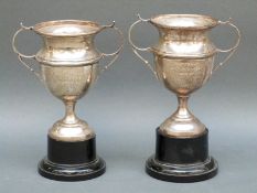 A pair of George VI hallmarked silver twin handled trophy cups, Birmingham 1938 weight of both 167g,