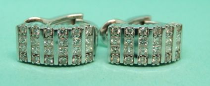 Splendore pair of 18ct white gold earrings each set with 12 princess cut diamonds and 12 round