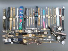 Over 50 various ladies and gentleman's wristwatches.