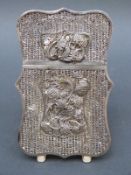 A 19thC Chinese filigree silver card case decorated with dragons, flowers verso,