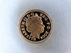 A 2004 gold proof £1 coin