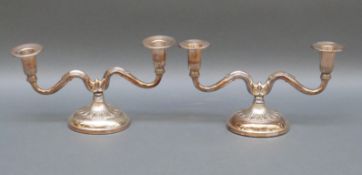 A pair of Swedish hallmarked silver candelabra with import marks for Birmingham,