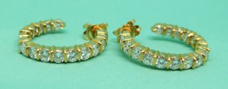 Kutchinsky pair of 18ct gold hoop earrings, each hoop set with 17 round brilliant cut diamonds,