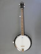 A 5 string banjo by Vintage, with 'Remo' head made in Italy,