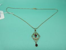 A 9ct gold pendant set with garnets on 9ct gold chain, 33.5g.