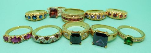 A yellow metal ring marked 14k and nine yellow metal rings marked 10k