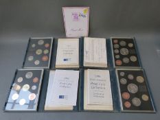Four deluxe cased Royal Mint coin sets for 1994, 1995,