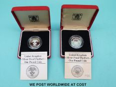 Two cased UK silver proof Piedfort £1 coins with certificates 1985 and 1986