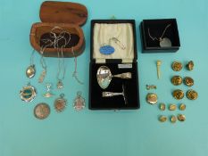 A collection of silver jewellery to include a locket, two pendants, chains, rolled gold locket,