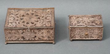A white metal filigree box 8.5 x 6 x 2.5cm and another smaller example 5.5 x 3.