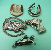 A collection of brooches including silver horseshoe set with agate, silver horses head,
