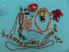 A pair of coral earrings, coral necklaces, silver ring in the form of a dragon set with coral,