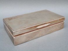 A hallmarked silver cigarette case with engine turned decoration, Birmingham 1962, width 14.