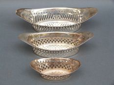 A Victorian graduated near set of three hallmarked silver pierced baskets,