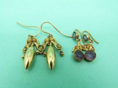 A pair of 9ct gold Edwardian earrings set with seed pearls and amethyst and a pair of 15ct gold