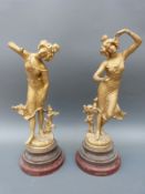 A pair of large spelter figures on marble bases Coquette and Surprise,