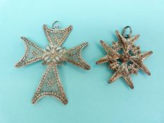Two white metal filigree pendants in the form of a Maltese cross with sphere decoration