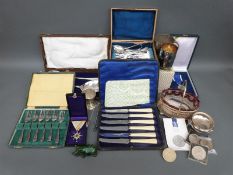 A quantity of silver plate to include cased cutlery, coins,