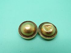 A pair of yellow metal earrings with textured border, weight 9.