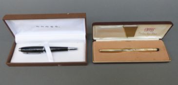 Two boxed Cross pens,
