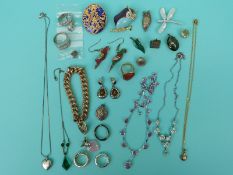 A collection of jewellery to include amber and silver earrings, garnet clasp, pearl brooch,