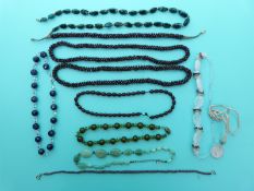 Three beaded garnet necklaces, a beaded ruby example made up of faceted beads, agate necklace,