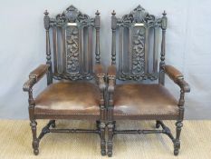 A pair of Victorian carved oak armchairs