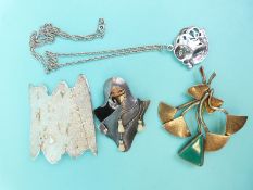 A hallmarked silver brooch, a silver brooch marked Zealandia in the form of a lady with ivory face,