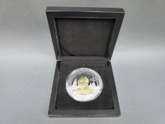 A 2015 Five Crowns 4oz silver coin with gold embellishment depicting Sir Winston Churchill, cased,