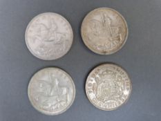 Three 1935 'rocking horse' crowns together with a 1937 George VI Coronation example and a George V