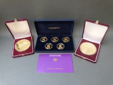 A large 20 dollar gold plated coin in case, 8oz weight, 88mm diameter,