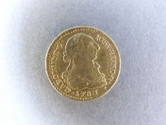 A 1783 gold Spanish Escudo bust of Charles III 3.