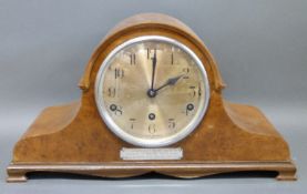 A Napoleon hat style c1930 mantel clock in case with walnut veneered decoration,