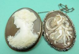 Two silver brooches set with cameos.