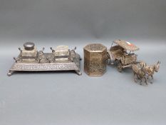 A possibly white metal hexagonal pot, similar horse drawn carriage,