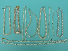 Eight strands of freshwater pearl necklaces in shades of pink