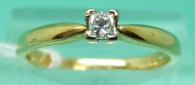 An 18ct gold ring set with a Princess cut diamond solitaire of approximately 0.