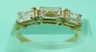 Three 9ct gold rings set with clear stones