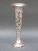 An Edward VII hallmarked silver trumpet vase with embossed floral decoration, Birmingham 1905,